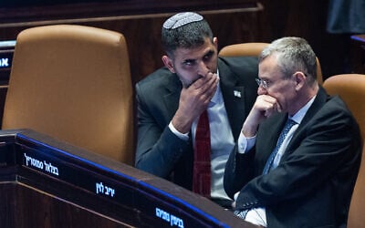 Communications Minister Shlomo Karhi (left) and Justice Minister Yariv Levin (right) attend a Knesset plenum session, January 8, 2025. (Yonatan Sindel/Flash90) Communications Minister Shlomo Karhi (left) and Justice Minister Yariv Levin (right) attend a Knesset plenum session, January 8, 2025. (Yonatan Sindel/Flash90)
