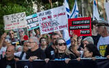 Protesters including former hostages and families of hostages demanding a state commission of inquiry march to Tel Aviv's Hostages Square during events marking the 1,000th day since the Hamas-led October 7, 2023, massacre, July 2, 2026. (Chaim Goldberg/Flash90)