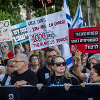 Protesters including former hostages and families of hostages demanding a state commission of inquiry march to Tel Aviv's Hostages Square during events marking the 1,000th day since the Hamas-led October 7, 2023, massacre, July 2, 2026. (Chaim Goldberg/Flash90)