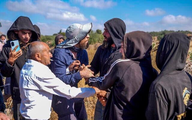 Palestinians and activists  clash with Israeli settlers during a protest against a new Israeli settlement in the village of Abu Falah, near Ramallah, in the West Bank, July 3,  2026. (STR)