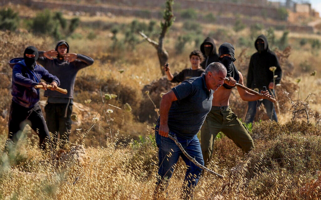 Illustrative: Palestinians and activists clash with Israeli settlers near the Ramallah-area Palestinian village of Abu Falah, in the West Bank, July 3, 2026. (Flash90) Illustrative: Palestinians and activists clash with Israeli settlers near the Ramallah-area Palestinian village of Abu Falah, in the West Bank, July 3, 2026. (Flash90)