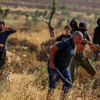 Illustrative: Palestinians and activists clash with Israeli settlers near the Ramallah-area Palestinian village of Abu Falah, in the West Bank, July 3, 2026. (Flash90)