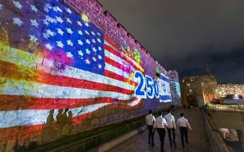 The walls of Jerusalem’s Old City are illuminated with the American and the Israeli flags to mark the 250th anniversary of the independence of the United States, outside the Old City of Jerusalem, July 4, 2026 (Chaim Goldberg/Flash90)