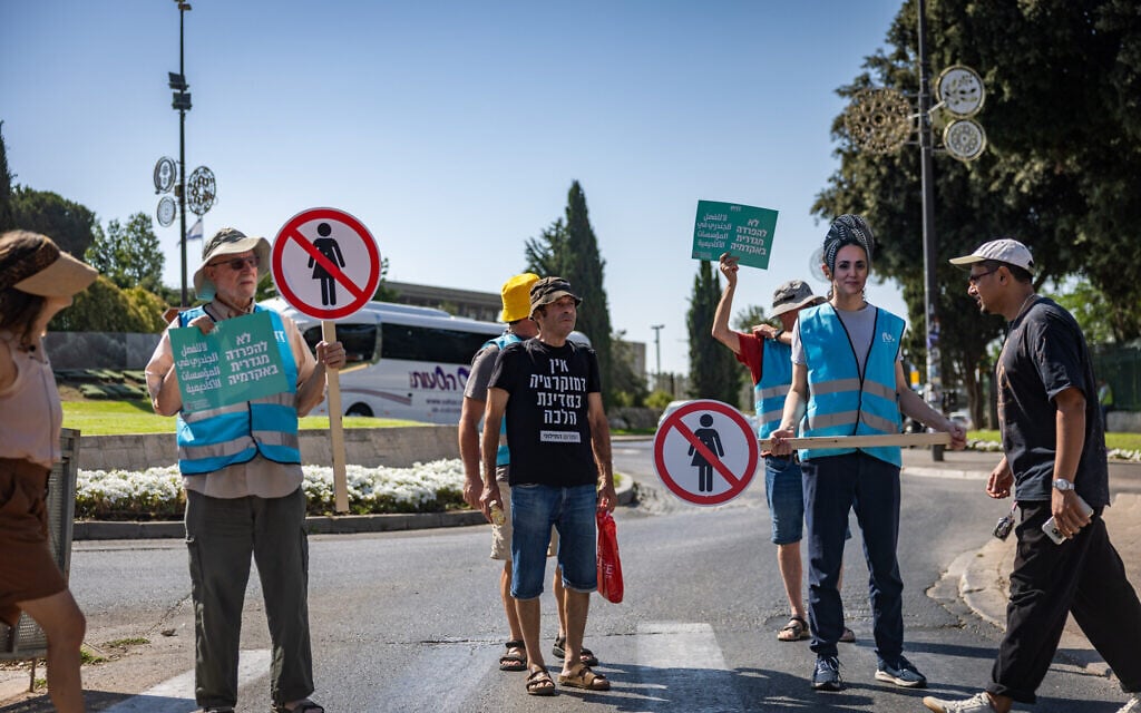 Activists protest against a bill promoting gender-segregated academic study tracks, introduced by MK Limor Son Har-Melech, outside the Knesset in Jerusalem, July 6, 2026. (Yonatan Sindel/Flash90)