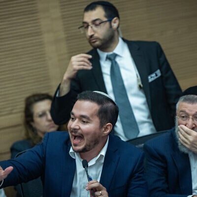 MK Dan Illouz (seated center) speaks at a Knesset House committee meeting, July 7, 2026. (Yonatan Sindel/Flash90) MK Dan Illouz (seated center) speaks at a Knesset House committee meeting, July 7, 2026. (Yonatan Sindel/Flash90)