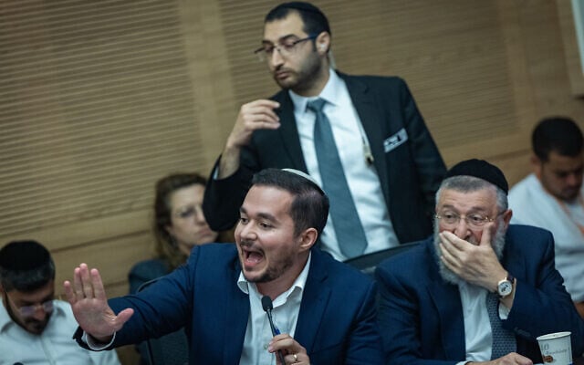 MK Dan Illouz (seated center) speaks at a Knesset House committee meeting, July 7, 2026. (Yonatan Sindel/Flash90)