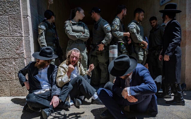 Ultra-Orthodox protesters demonstrate against a cafe operating on Shabbat in central Jerusalem, July 11, 2026. (Yonatan Sindel/Flash90)