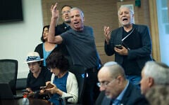 Yesh Atid MK Elazar Stern (left) and Yesh Atid MK Meir Cohen (right) shout during a Knesset Foreign Affairs and Defense Committee hearing on legislation to freeze the arrest of ultra-Orthodox draft dodgers, July 12, 2026. (Chaim Goldberg/Flash90)