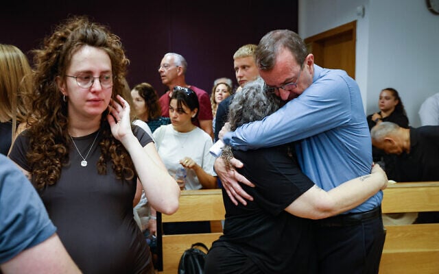 Family members of Maya Vishniak after her partner is sentenced for her murder at the Tel Aviv District Court in Tel Aviv, July 12, 2026 (Yehoshua Yosef/Flash90)