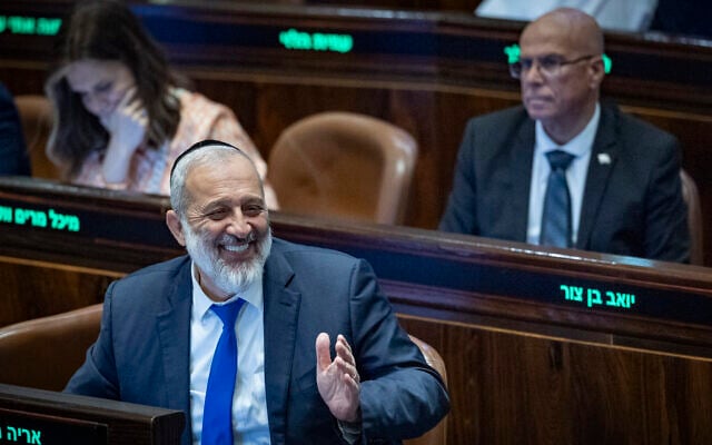 Shas Chairman MK Aryeh Deri smiles during a Knesset session at which a Basic Law defining Torah study as a foundational value was passed, July 13, 2026 (Chaim Goldberg/Flash90)