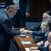 United Torah Judaism MKs Yitzhak Pindrus (left), Moshe Gafni, and Yitzhak Goldknopf seen in the Knesset at a session where a Basic Law enshrining Torah study as a foundational value of the state was approved, July 13, 2026. (Chaim Goldberg/Flash90)