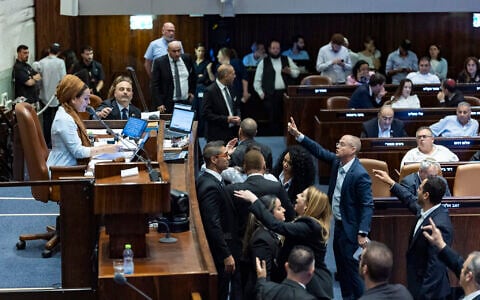 A plenum session and a vote on a bill to freeze arrests of Haredi draft evaders at the assembly hall of the Knesset in Jerusalem, July 14, 2026. (Chaim Goldberg/Flash90)