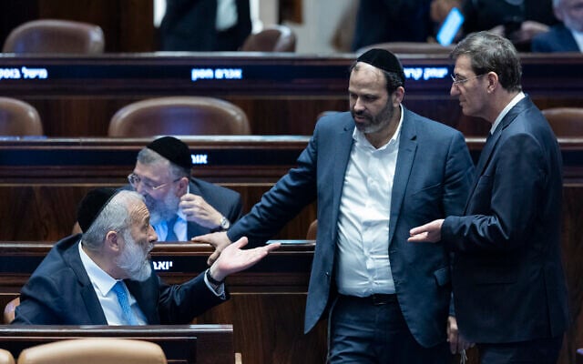 Likud MK Boaz Bismuth (right), Shas chairman Aryeh Deri (left) and Shas MK Yinon Azoulay seen during a plenum session and a vote on a bill to freeze arrests of Haredi draft evaders at the Knesset in Jerusalem, July 14, 2026. (Chaim Goldberg/Flash90) Likud MK Boaz Bismuth (right), Shas chairman Aryeh Deri (left) and Shas MK Yinon Azoulay seen during a plenum session and a vote on a bill to freeze arrests of Haredi draft evaders at the Knesset in Jerusalem, July 14, 2026. (Chaim Goldberg/Flash90)