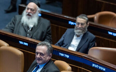 Defense Minister Israel Katz attends a plenum session and a vote on a bill to freeze arrests of haredi draft evaders at the assembly hall of the Knesset in Jerusalem, July 14, 2026. (Chaim Goldberg/Flash90)