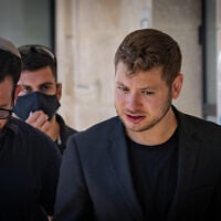 Yair Netanyahu arrives for a court hearing on his request for a restraining order against Haaretz journalist Uri Misgav at the Jerusalem District Court in Jerusalem, July 15, 2026. (Chaim Goldberg/Flash90)