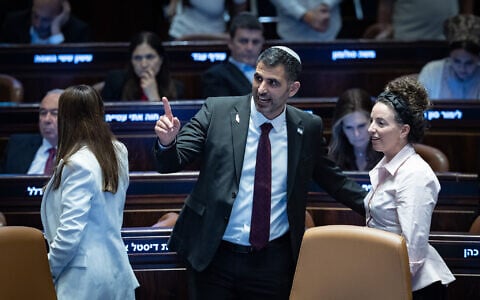Communications Minister Shlomo Karhi, center, attends a vote at the plenum hall of the Knesset in Jerusalem, on July 16, 2026. (Yonatan Sindel/Flash90)