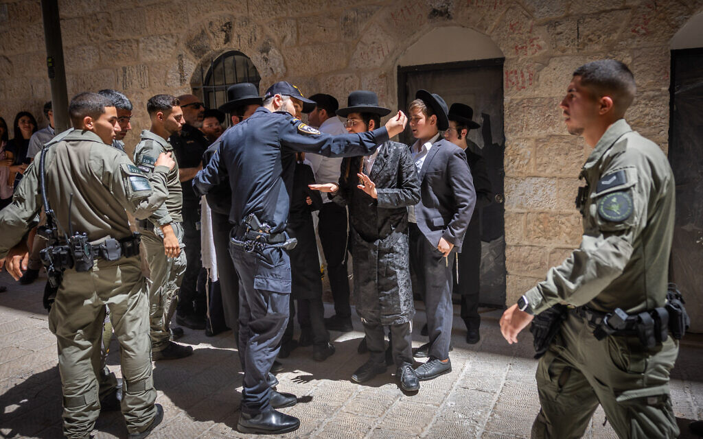Ultra-Orthodox protesters demonstrate against a cafe operating on Shabbat, in central Jerusalem, July 18, 2026. (Yonatan Sindel/Flash90)