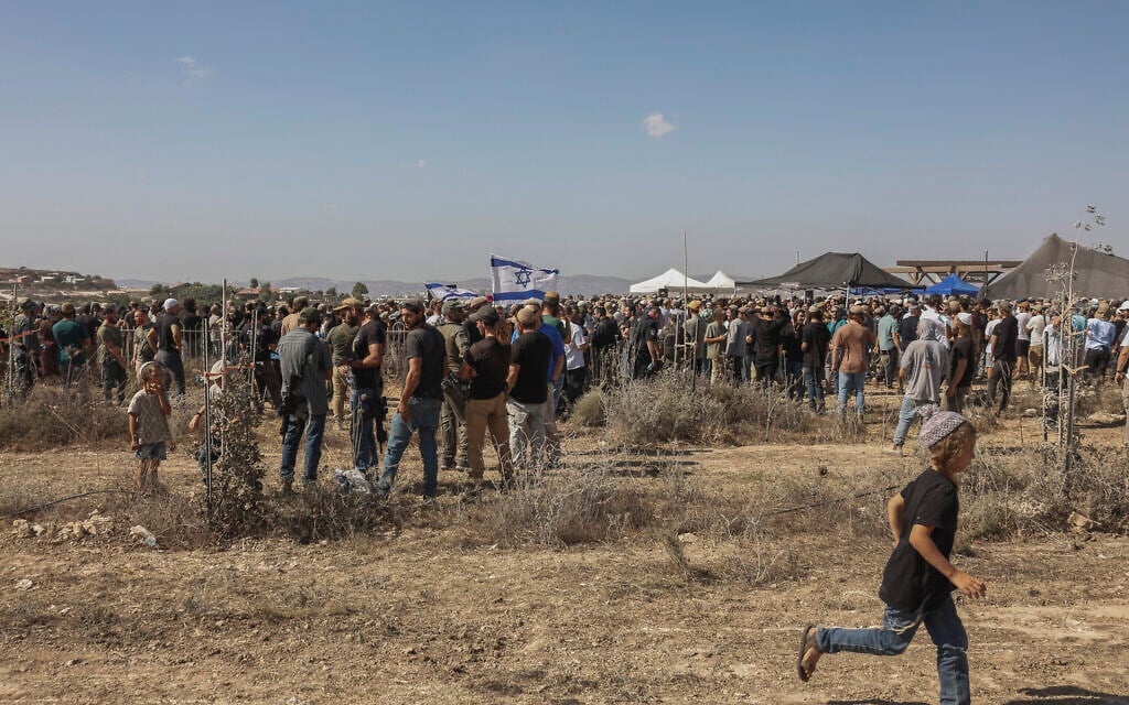 Family, friends and residents attend the funeral of Benayahu Mellet at the Israeli settlement of Havat Gilad in the West Bank, July 24, 2026. (Hilel Ben Or/Flash90)