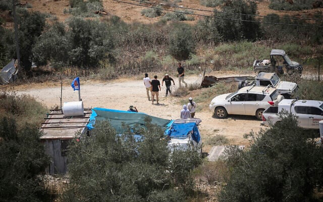 Israeli settlers are seen establishing an outpost on the outskirts of the village of Tell, near the West Bank city of Nablus, July 25, 2026. (Nasser Ishtayeh/Flash90)
