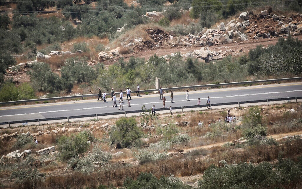 Israeli settlers are seen on the outskirts of the village of Tell, near the West Bank city of Nablus, July 25, 2026. (Nasser Ishtayeh/Flash90) Israeli settlers are seen on the outskirts of the village of Tell, near the West Bank city of Nablus, July 25, 2026. (Nasser Ishtayeh/Flash90)