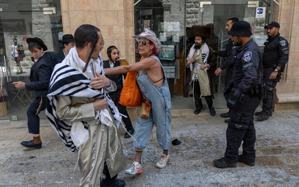 Ultra-Orthodox protesters demonstrate against a cafe operating on Shabbat while secular protesters demonstrate in support of the cafe in central Jerusalem, July 25, 2026. (Yonatan Sindel/Flash90) Ultra-Orthodox protesters demonstrate against a cafe operating on Shabbat while secular protesters demonstrate in support of the cafe in central Jerusalem, July 25, 2026. (Yonatan Sindel/Flash90)