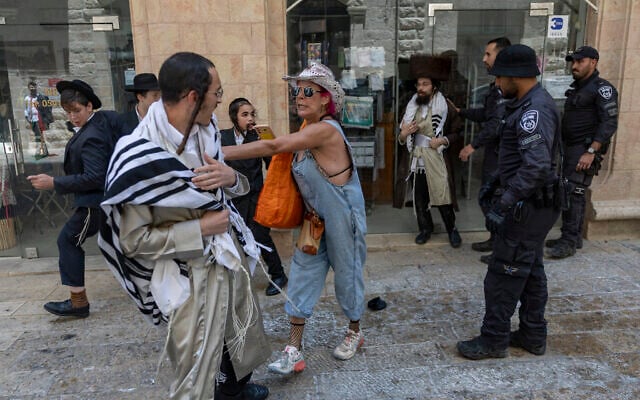Ultra-Orthodox protesters demonstrate against a cafe operating on Shabbat while secular protesters demonstrate in support of the cafe in central Jerusalem, July 25, 2026. (Yonatan Sindel/Flash90)