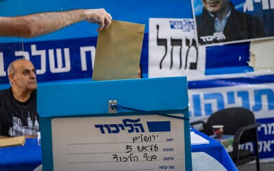 A person votes at a polling station during the Likud party internal vote in Jerusalem, July 27, 2026. (Chaim Goldberg/Flash90) A person votes at a polling station during the Likud party internal vote in Jerusalem, July 27, 2026. (Chaim Goldberg/Flash90)