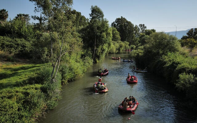 People enjoy the Banias Nature Reserve, near Kibbutz Sde Nehemia in the Upper Galilee, July 29, 2026. (Michael Giladi/Flash90)