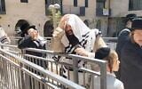 Ultra-Orthodox protesters pray and make noise outside Cafe Basimta, in Jerusalem, July 4, 2026. (X screenshot: used in accordance with Clause 27a of the Copyright Law)