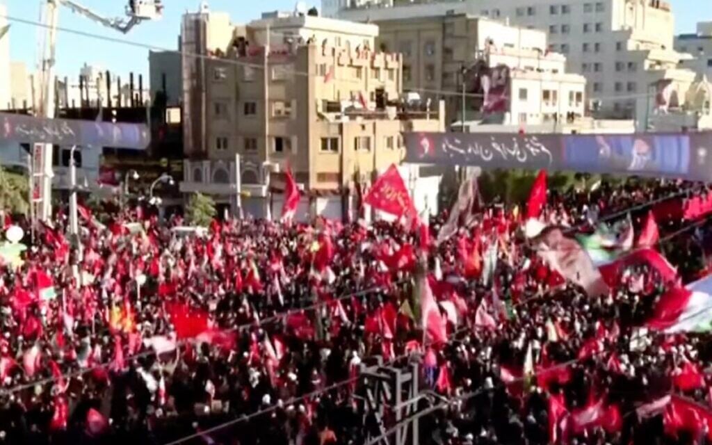 ‘People here all seek revenge’: Crowds mass for Khamenei’s burial, banners call to kill Trump