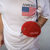 A Jewish supporter of US President Donald Trump holds a Trump kippah in front of Trump Tower in midtown Manhattan, November 6, 2024. (Luke Tress/Times of Israel)