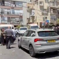 Ultra-Orthodox residents surround and attack a car presumably carrying Israel Tax Authority employees in Bnei Brak, July 16, 2026. (X video/used in accordance with Clause 27a of the Copyright Law)