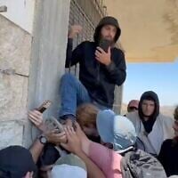 Solidarity activists work to block settlers from entering a building in the West Bank village of Jurish, July 17, 2026. (X video/used in accordance with Clause 27a of the Copyright Law)