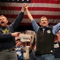 Graham Platner and Troy Jackson (R), who is running to replace Platner as the Democratic nominee for the U.S. Senate, stand together during a “Fighting Oligarchy” tour stop at the Collins Center for the Arts on the University of Maine campus on May 24, 2026, in Orono, Maine. (Joe Raedle/Getty Images via JTA)