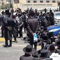 Screen capture from video of ultra-Orthodox protesters outside the IDF's recruitment center in Tel Hashomer, Ramat Gan, July 15, 2026. (Video screenshot)