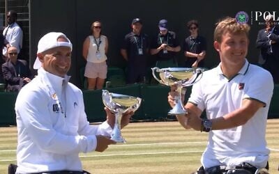 Israel's Guy Sasson, left, and Netherlands' Niels Vink receive the Wimbledon trophy after winning the quad wheelchair doubles on July 11, 2026. (Screenshot: Wimbledon/YouTube) Israel's Guy Sasson, left, and Netherlands' Niels Vink receive the Wimbledon trophy after winning the quad wheelchair doubles on July 11, 2026. (Screenshot: Wimbledon/YouTube)