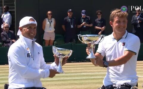 Israel's Guy Sasson, left, and Netherlands' Niels Vink receive the Wimbledon trophy after winning the quad wheelchair doubles on July 11, 2026. (Screenshot: Wimbledon/YouTube)