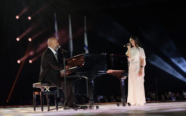 Musician Idan Raichel and former hostage Daniella Gilboa perform at the opening ceremony of the Maccabiah Games at Teddy Stadium in Jerusalem, July 1, 2026 (Maccabiah/Roey Yehuda)