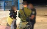 An off-duty IDF servicewoman speaks with Israeli security forces after being extracted from the West Bank city of Jericho, July 10, 2026. (Civil Administration)