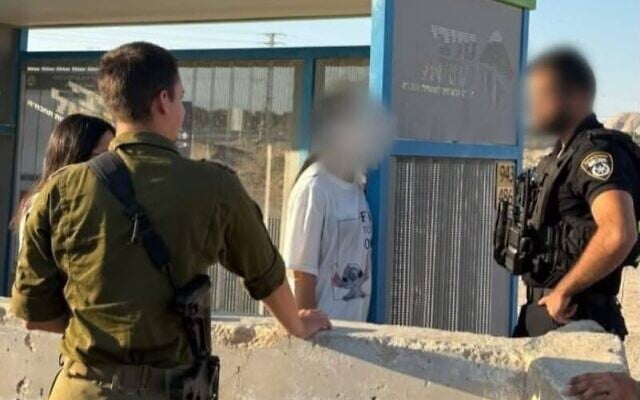Two Israeli women speak with Israeli security forces after being extracted from the West Bank city of Jericho, July 11, 2026. (Civil Administration)