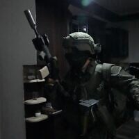 Police raid a building during a wave of arrests carried out against suspects in a drug and arms trafficking network in southern Israel and East Jerusalem, on July 13, 2026. (Israel Police)