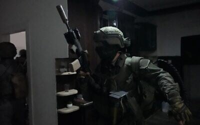 Police raid a building during a wave of arrests carried out against suspects in a drug and arms trafficking network in southern Israel and East Jerusalem, on July 13, 2026. (Israel Police)