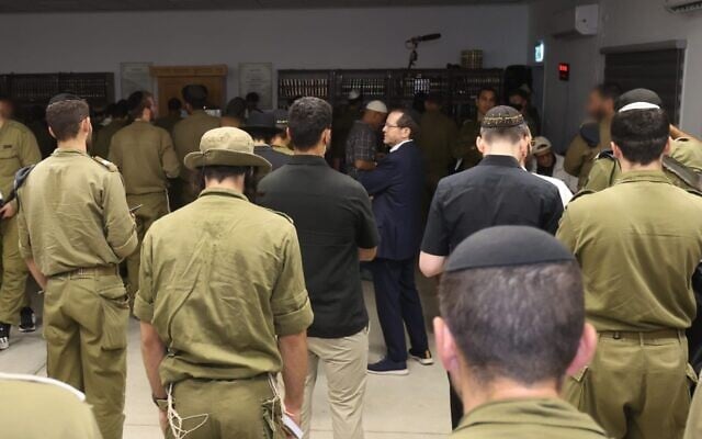 President Isaac Herzog visits a military base on Tisha B'av and meets with members of the Hasmonean Brigade, July 22, 2026. (Alex Kolomoisky/President's Office)