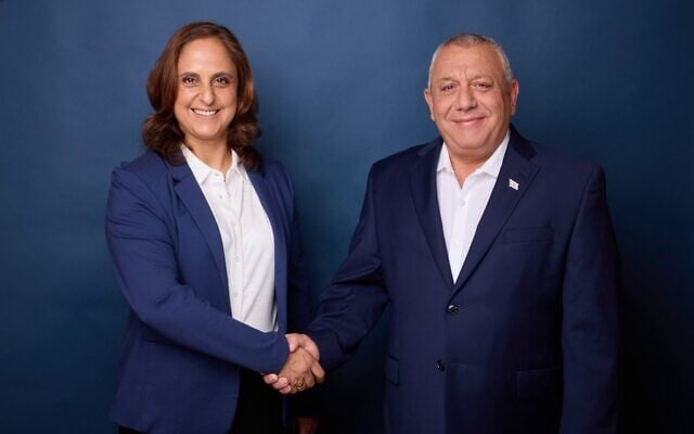Yashar party chief Gadi Eisenkot, right, welcomes former Shin Bet and Mossad official Dvora Sharifian Bachar to the party in a handout photo released on July 9, 2026. (Courtesy Yashar)
