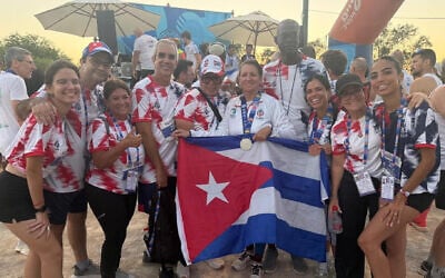 Hella Eskenazi (C) poses with the Cuban delegation for the Maccabiah Games in Israel. (Courtesy Hella Eskenazi) Hella Eskenazi (C) poses with the Cuban delegation for the Maccabiah Games in Israel. (Courtesy Hella Eskenazi)