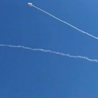 An interception seen in the sky near the Israeli city of Eilat and adjacent Jordanian city of Aqaba amid an Iranian missile attack on July 19, 2026. (screen capture: Telegram)