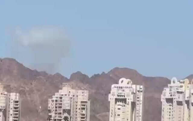 A plume of smoke is seen in the distance from Eilat after an Iranian missile attack on Jordan on July 22, 2026. (Screen capture: Telegram)