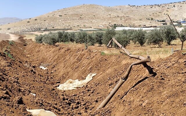 A water pipeline severed during construction of the security barrier in the northern Jordan Valley, July 2026. (Ilan Volkov/Jordan Valley Activists)