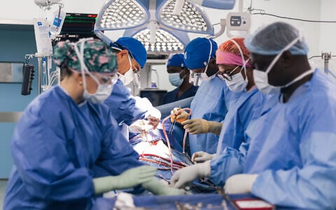 Israeli cardiac surgeons from Wolfson Medical Center in Holon and Save a Child's Heart (SACH) and Zambian surgeons perform open-heart surgery on a child in an operating room at National Heart Hospital in Lusaka, Zambia, on July 14, 2026. (Courtesy/Save a Child's Heart)