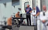 Former Hamas hostage Alon Ohel, left, plays the keys as US singer John Ondrasik sings his hit ballad 'Superman' aboard the USS Nimitz aircraft carrier in New York Harbor on July 4, 2026. (Screen capture: PR via X)